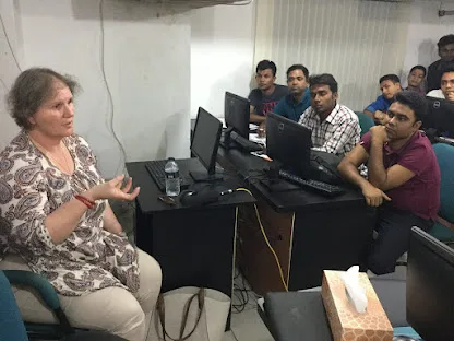 MIT representative speaking with students in Dhaka