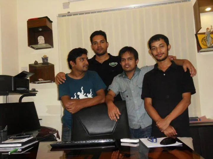 Four Srija BD Limited team members in the office